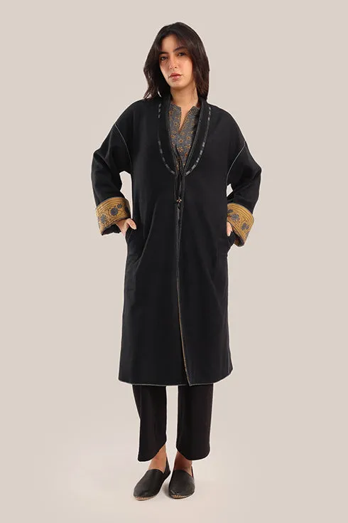 Reversible long sleeve coat in polar fleece and printed cotton with embroidered collar, and functional pockets.