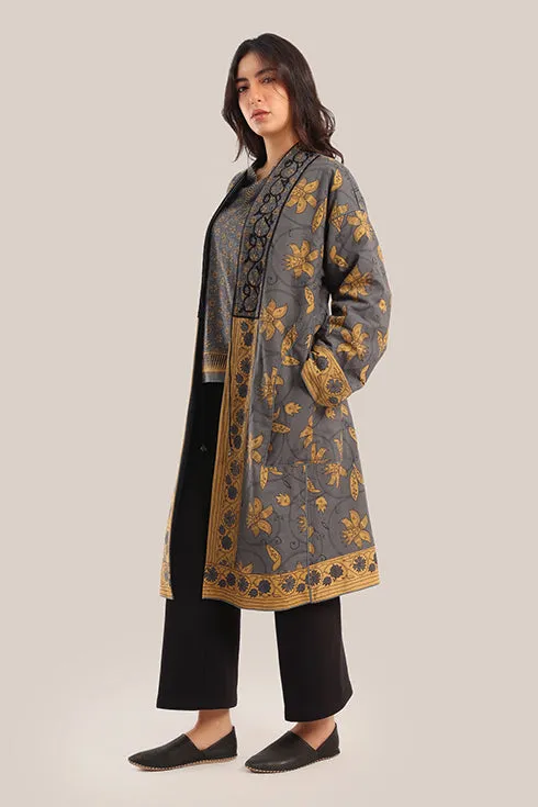 Reversible long sleeve coat in polar fleece and printed cotton with embroidered collar, and functional pockets.