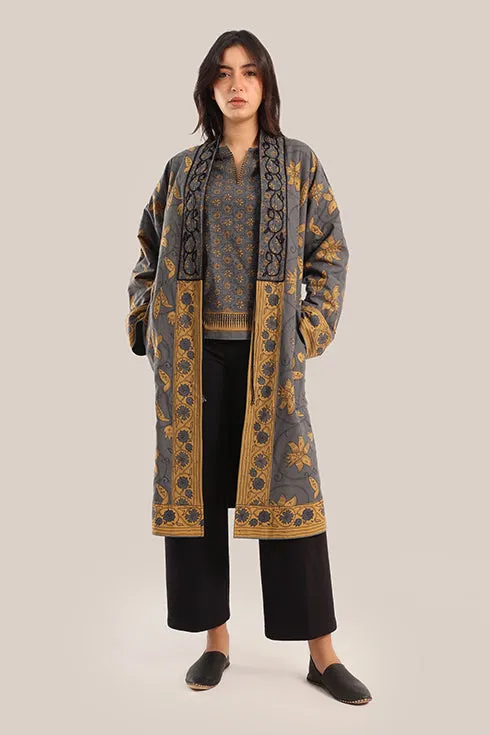 Reversible long sleeve coat in polar fleece and printed cotton with embroidered collar, and functional pockets.