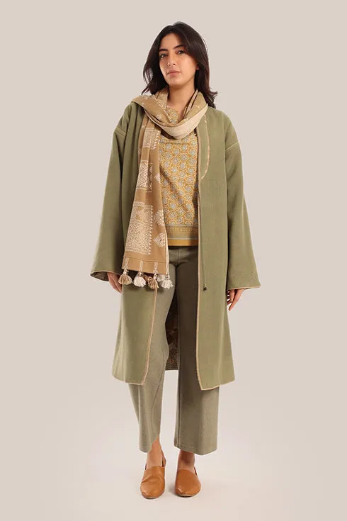 Reversible long sleeve coat in polar fleece and printed cotton with embroidered collar, and functional pockets.