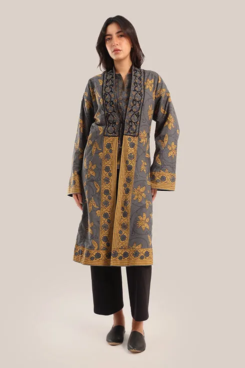 Reversible long sleeve coat in polar fleece and printed cotton with embroidered collar, and functional pockets.