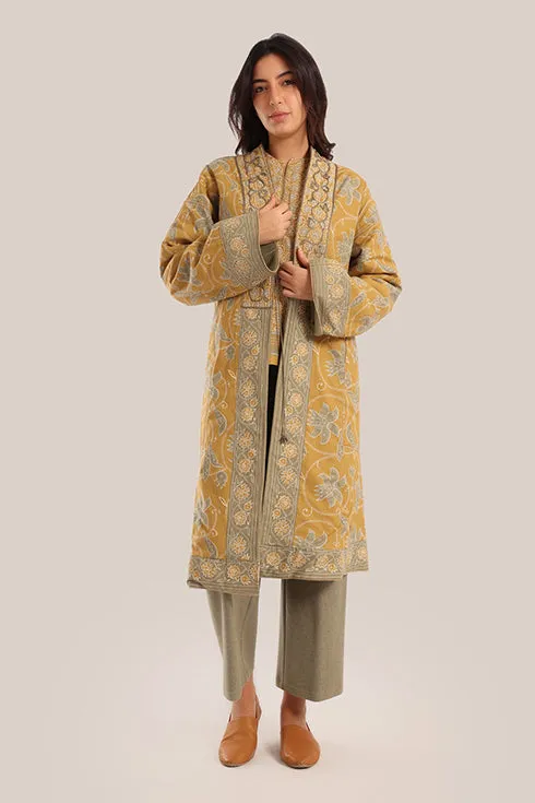 Reversible long sleeve coat in polar fleece and printed cotton with embroidered collar, and functional pockets.