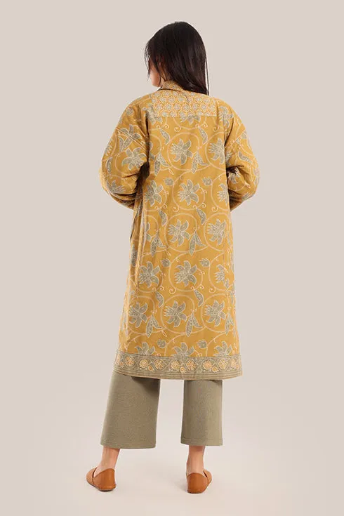 Reversible long sleeve coat in polar fleece and printed cotton with embroidered collar, and functional pockets.