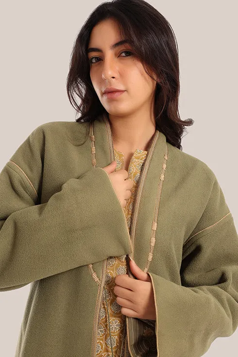 Reversible long sleeve coat in polar fleece and printed cotton with embroidered collar, and functional pockets.
